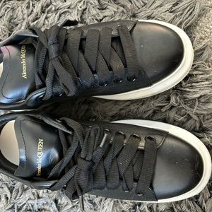 COPY - Authentic use black and white Alexandra, McQueen’s designer shoes, and a…